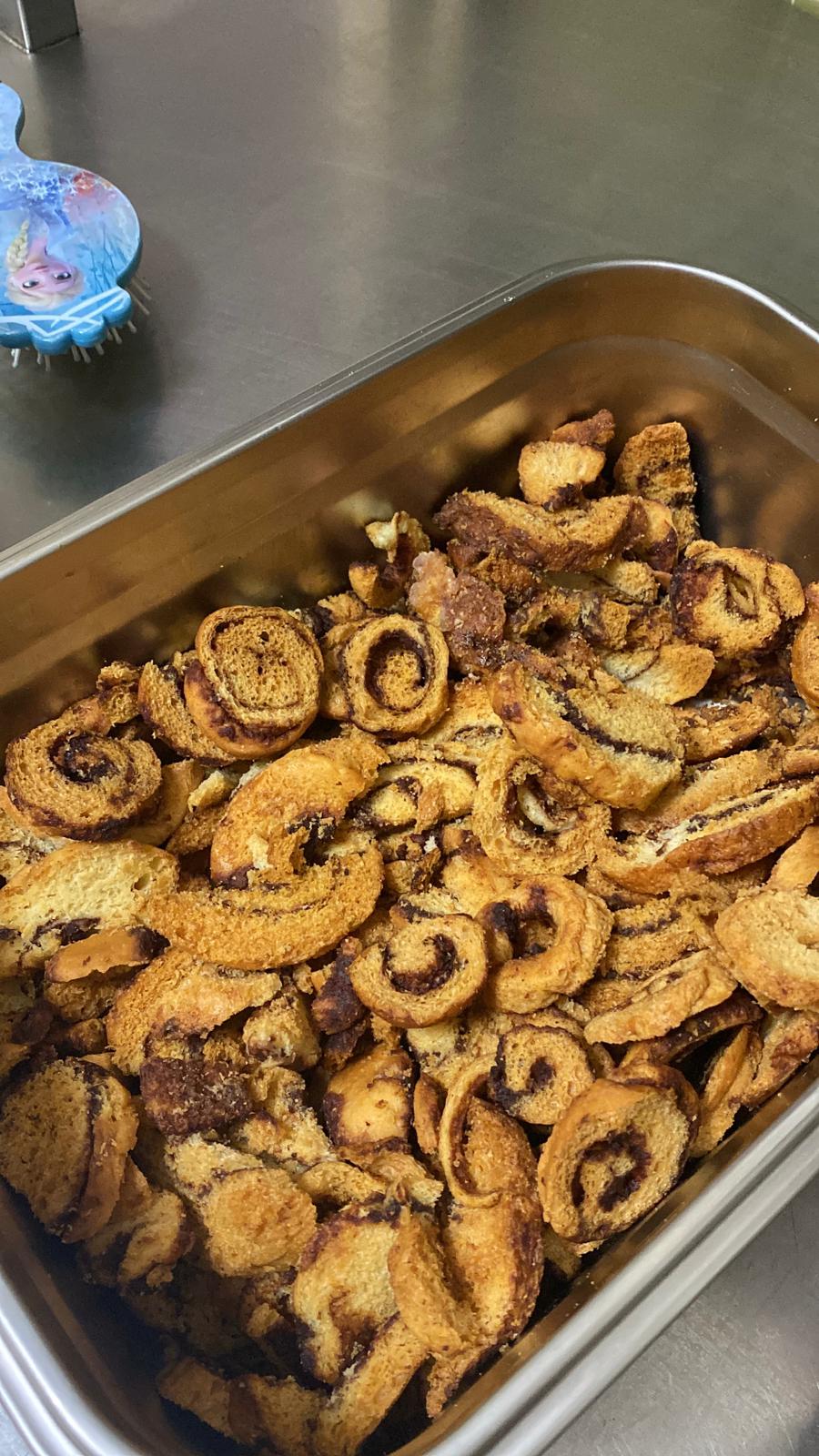 Metal tray filled with baked cinnamon crisps