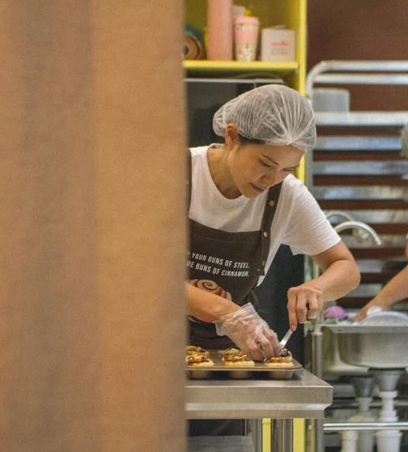 Joyce Chung of GFF preparing cinnamon rolls in her kitchen