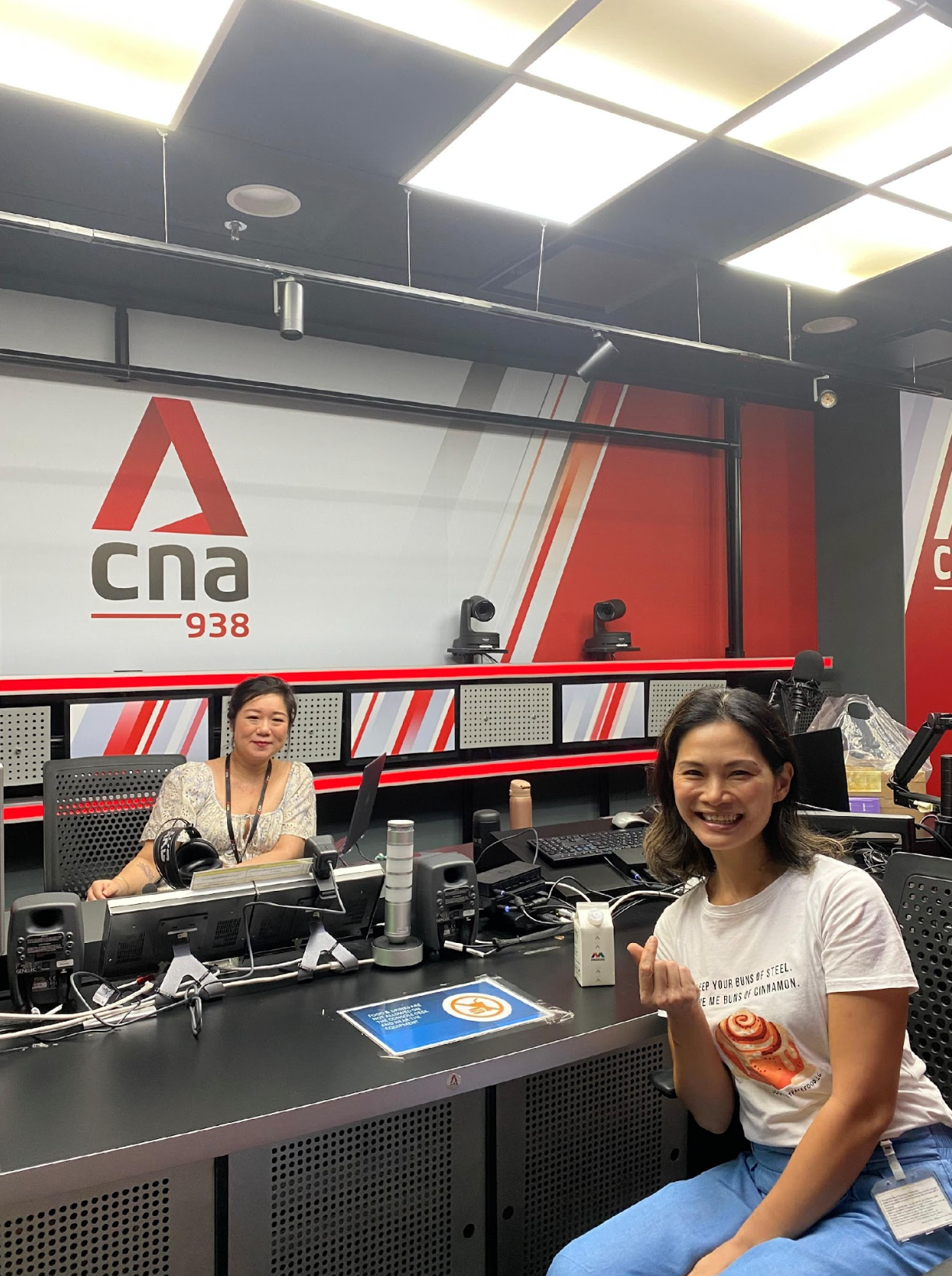 Joyce in a radio studio with 'CNA 938' 